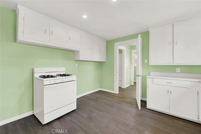 1312 4th, Corning, CA 96021 - kitchen with white gas stove, white cabinets, dark wood-style floors, and recessed lighting