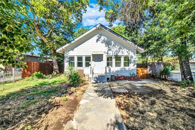 bungalow-style house featuring a patio