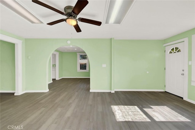 unfurnished living room featuring hardwood / wood-style floors and ceiling fan