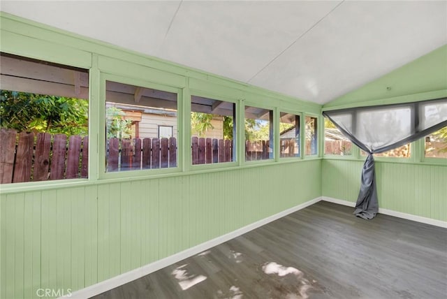 unfurnished sunroom featuring lofted ceiling