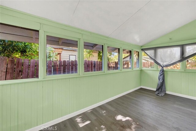 1312 4th, Corning, CA 96021 - unfurnished sunroom with vaulted ceiling, wood finished floors, and plenty of natural light