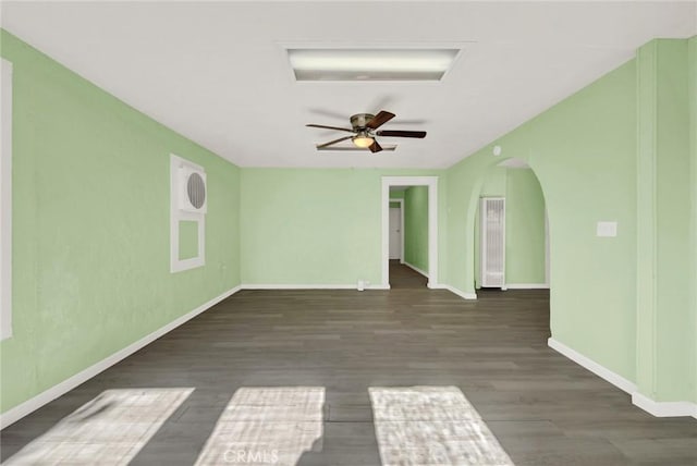 1312 4th, Corning, CA 96021 - unfurnished room with arched walkways, wood finished floors, and ceiling fan