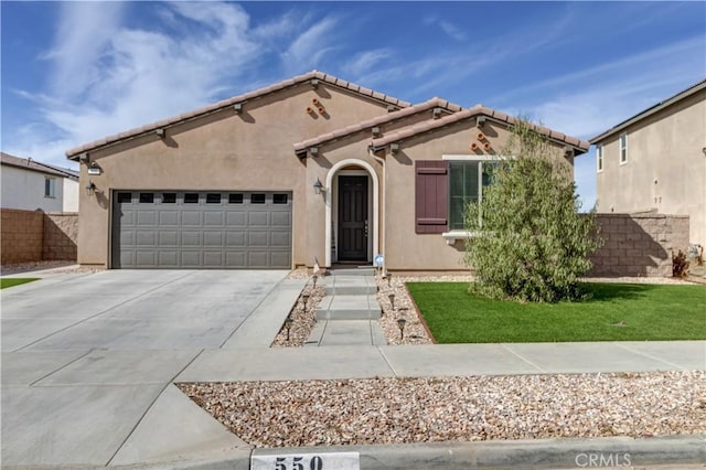 view of front of home featuring a garage and a front lawn