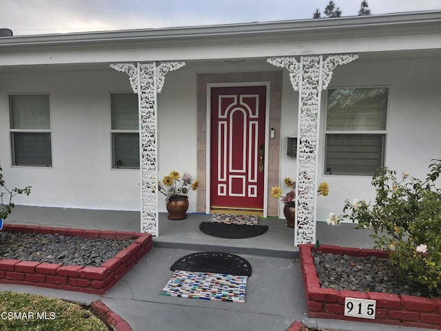 entrance to property with covered porch