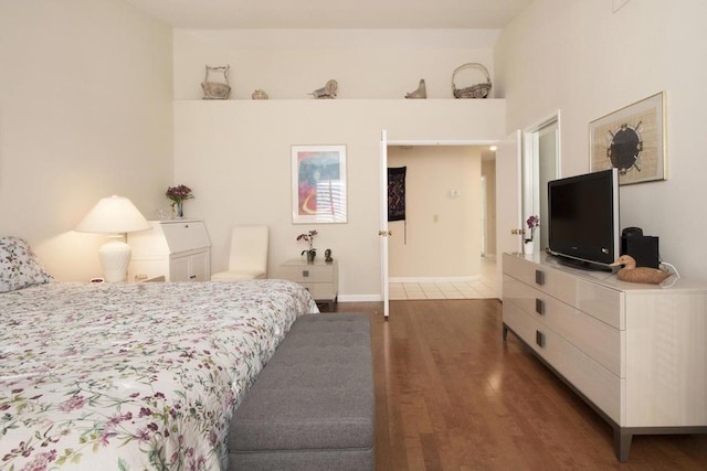 bedroom featuring dark hardwood / wood-style flooring