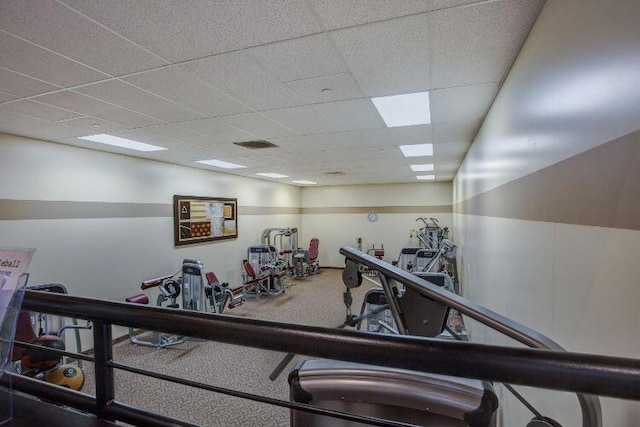 workout area with a paneled ceiling