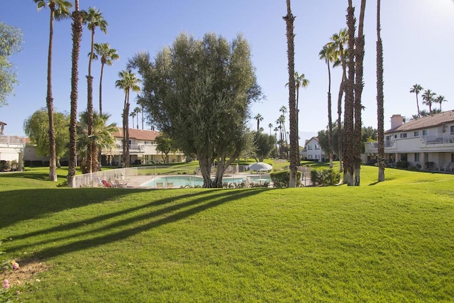 view of home's community featuring a yard