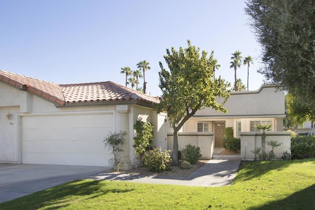 view of front facade featuring a front yard and a garage