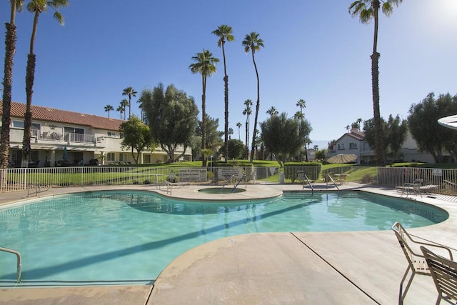 view of swimming pool with a patio