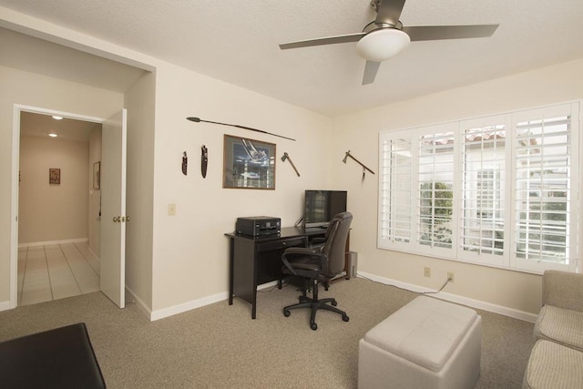 office featuring carpet flooring and ceiling fan