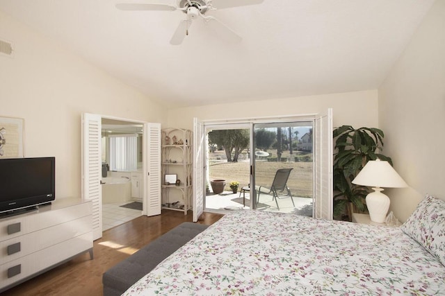 bedroom featuring ensuite bath, access to outside, ceiling fan, dark wood-type flooring, and lofted ceiling