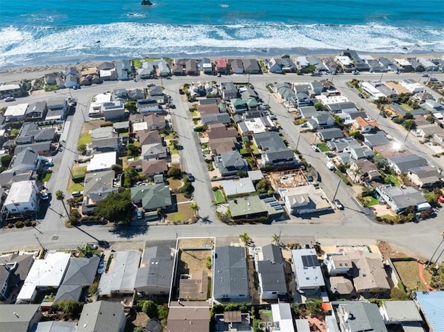 bird's eye view featuring a water view and a view of the beach