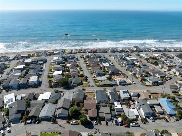 birds eye view of property featuring a view of the beach and a water view