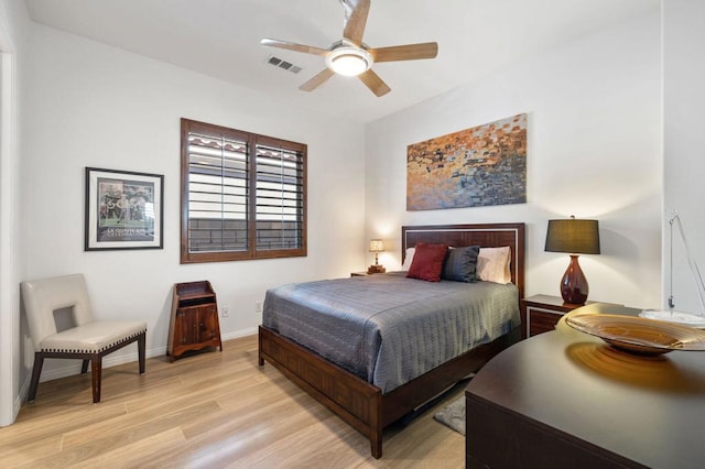 bedroom with light hardwood / wood-style flooring and ceiling fan