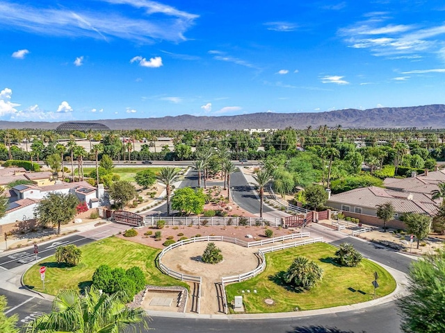 birds eye view of property with a mountain view