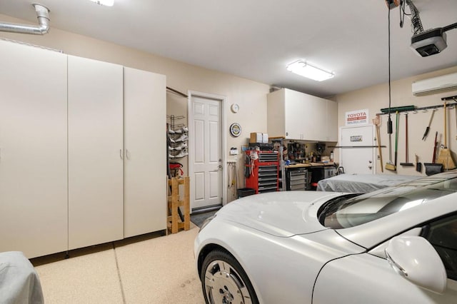 garage with a workshop area, a garage door opener, and an AC wall unit