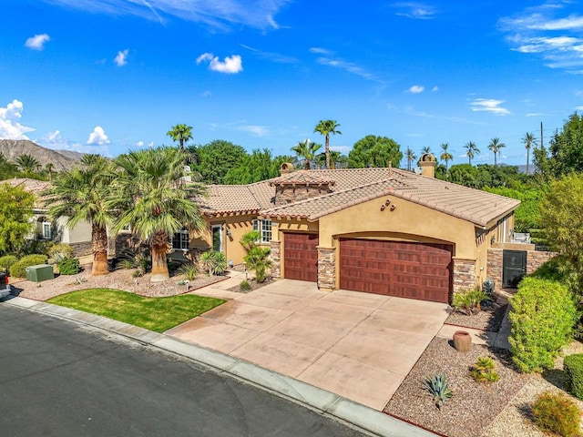 mediterranean / spanish house featuring a garage