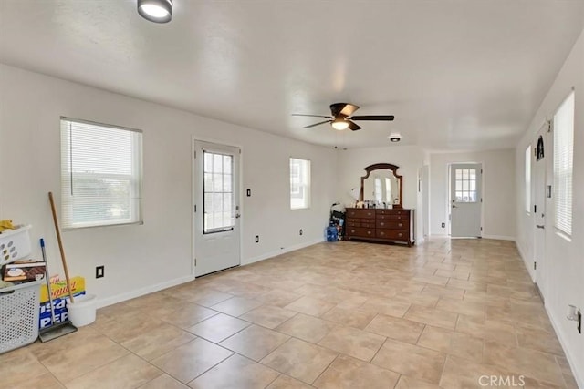 entrance foyer featuring ceiling fan and light tile patterned floors