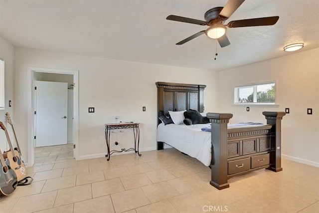 bedroom with ceiling fan and light tile patterned floors