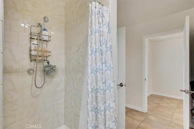 bathroom featuring tile patterned floors and a shower with curtain