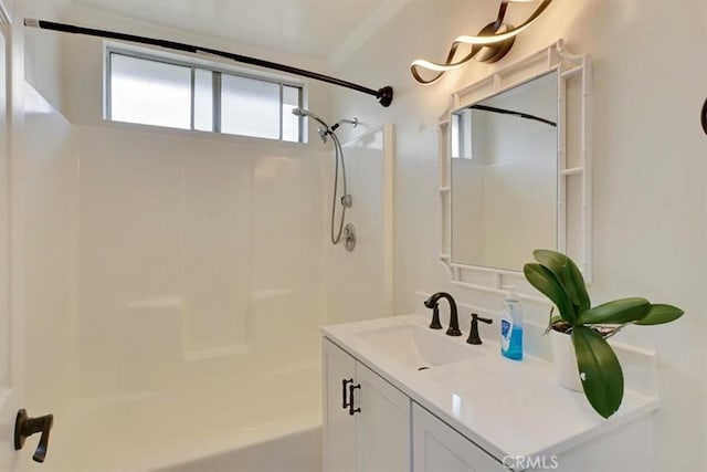 bathroom featuring a shower and vanity