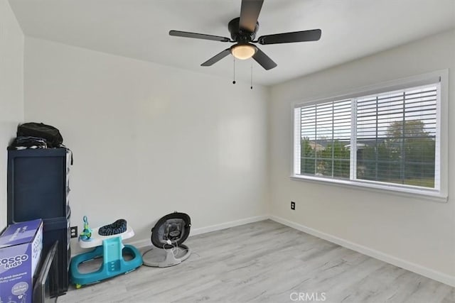 unfurnished room with ceiling fan and light wood-type flooring