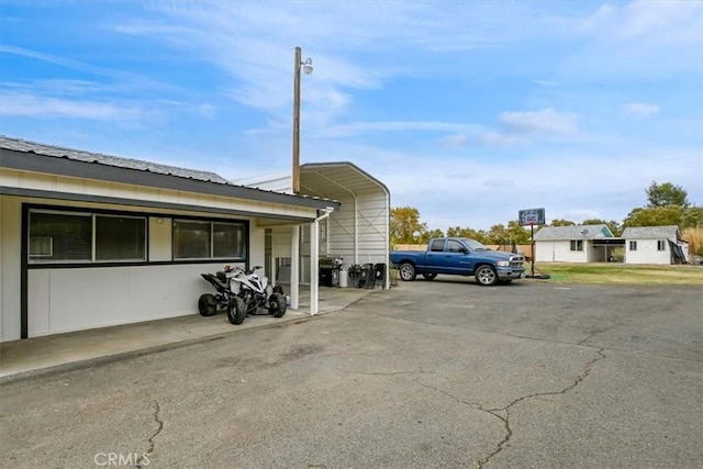 view of car parking with a carport