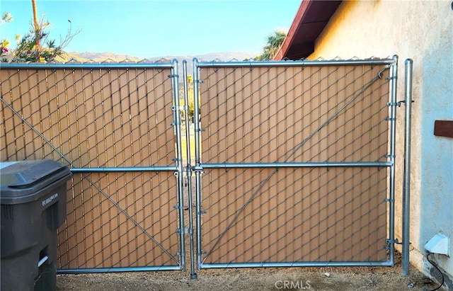 view of gate featuring a mountain view