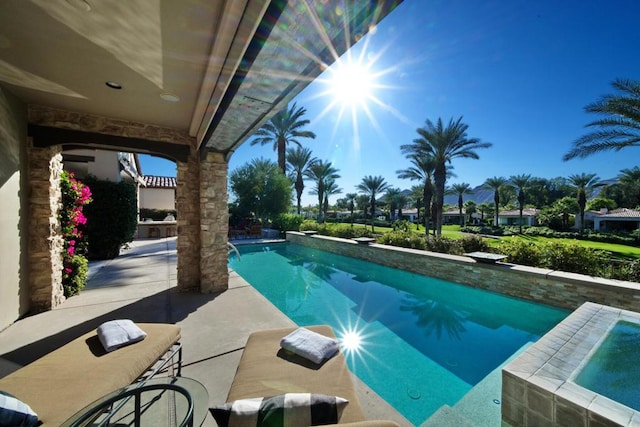 view of pool with a diving board and a patio area