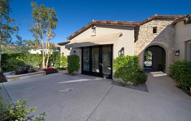 property entrance featuring french doors