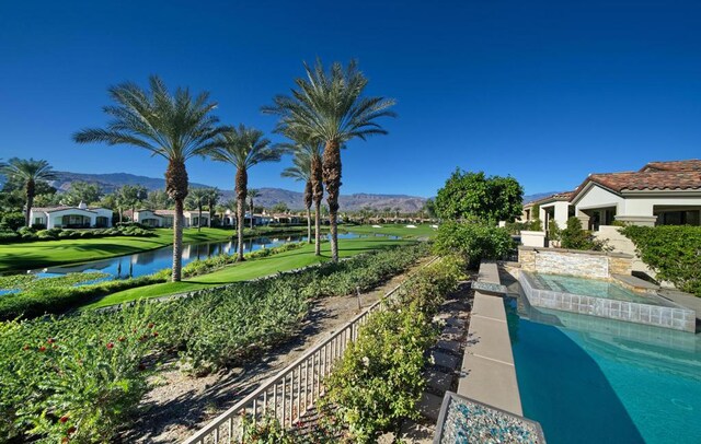 view of pool featuring a water and mountain view