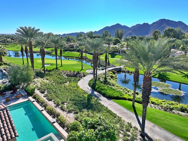 view of community featuring a yard and a water and mountain view