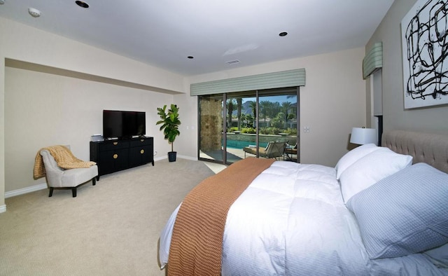 carpeted bedroom featuring access to outside