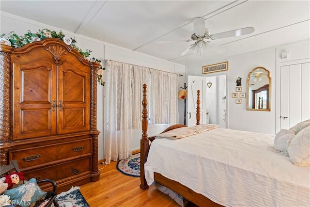 bedroom with ceiling fan and light wood-type flooring