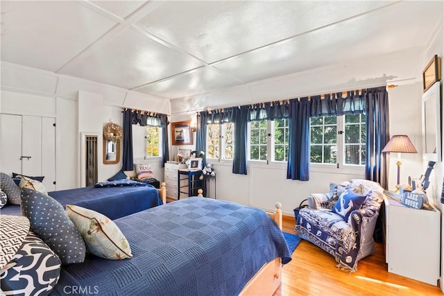 bedroom with hardwood / wood-style flooring