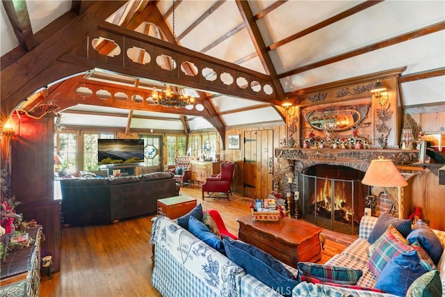 197 Rocky Point Rd, Lake Arrowhead, CA 92352 - living area with high vaulted ceiling, hardwood / wood-style floors, a chandelier, beam ceiling, and a warm lit fireplace