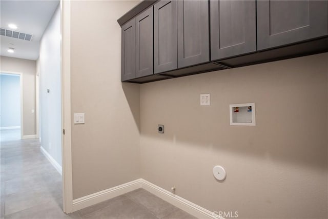 laundry area featuring cabinets, washer hookup, electric dryer hookup, gas dryer hookup, and light tile patterned floors