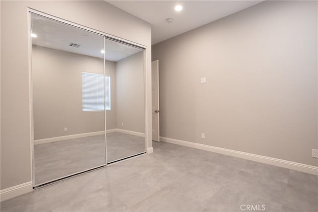 unfurnished bedroom with a closet