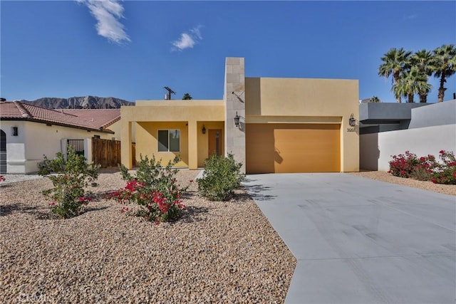 view of front facade featuring a mountain view and a garage