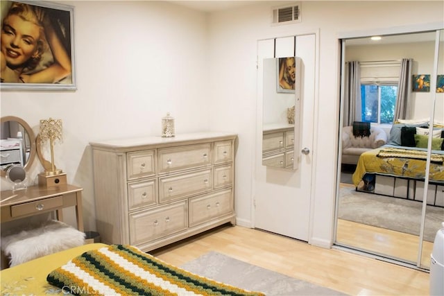 bedroom with a closet and light wood-type flooring