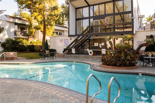 view of swimming pool featuring a patio