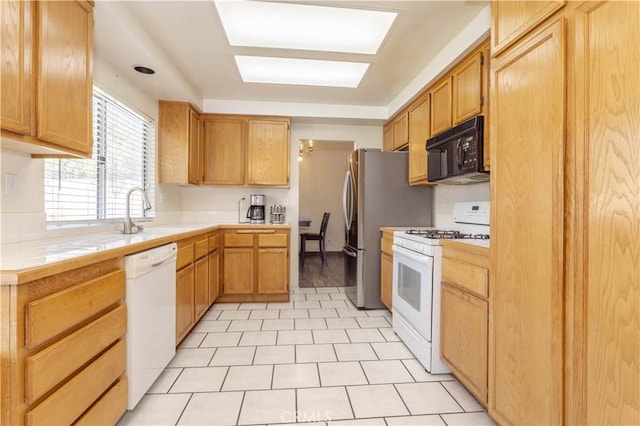 kitchen with white appliances and sink