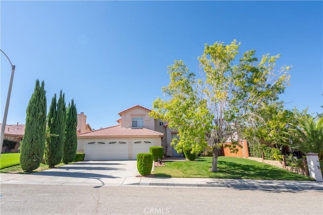 view of front facade with a front yard and a garage