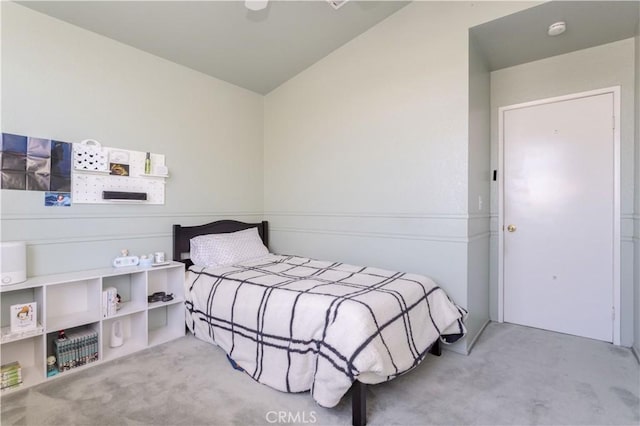 carpeted bedroom featuring vaulted ceiling