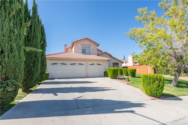 view of front of house featuring a front yard and a garage