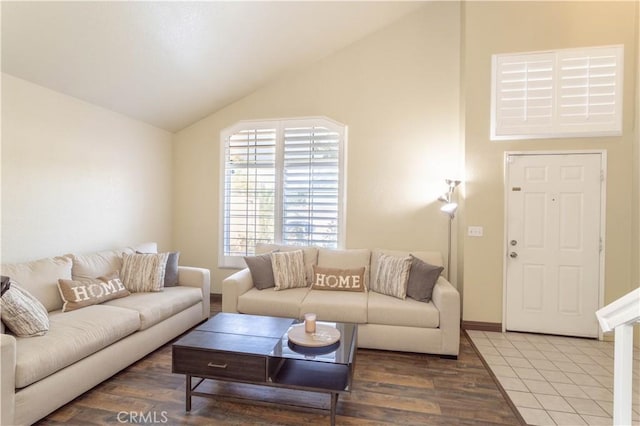 living room with wood-type flooring and vaulted ceiling