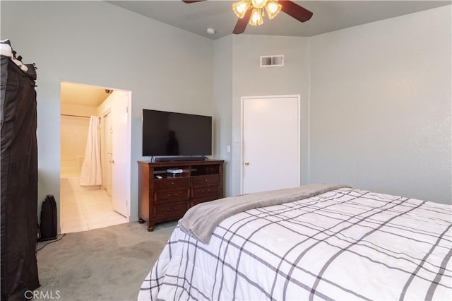 carpeted bedroom featuring ceiling fan and connected bathroom