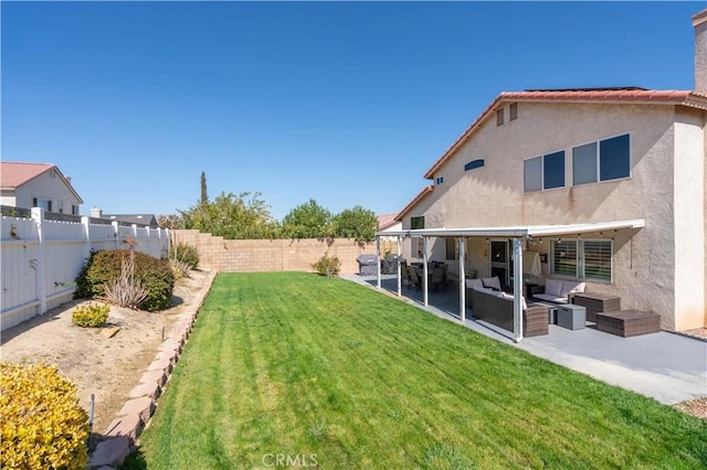 view of yard with an outdoor living space and a patio