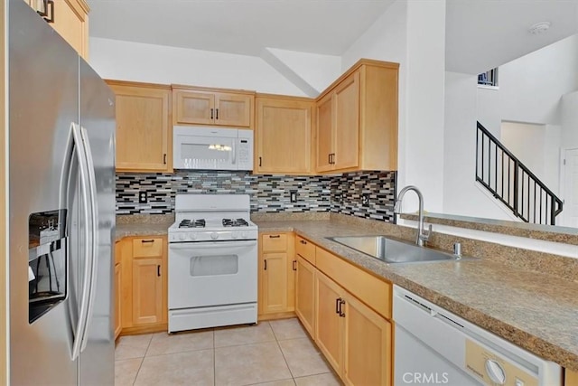 kitchen with white appliances, backsplash, sink, light brown cabinetry, and light tile patterned flooring