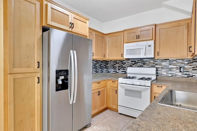 kitchen featuring light brown cabinets, white appliances, sink, tasteful backsplash, and light tile patterned flooring